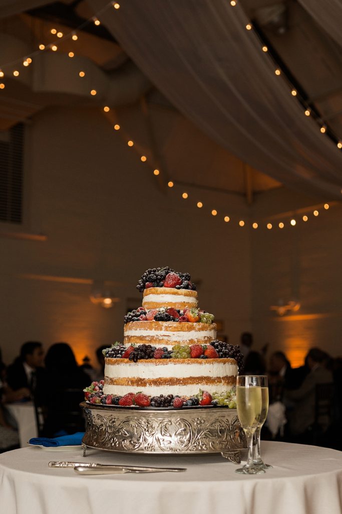 twinkle lights and wedding cake at the carriage house at the gardens at elm bank