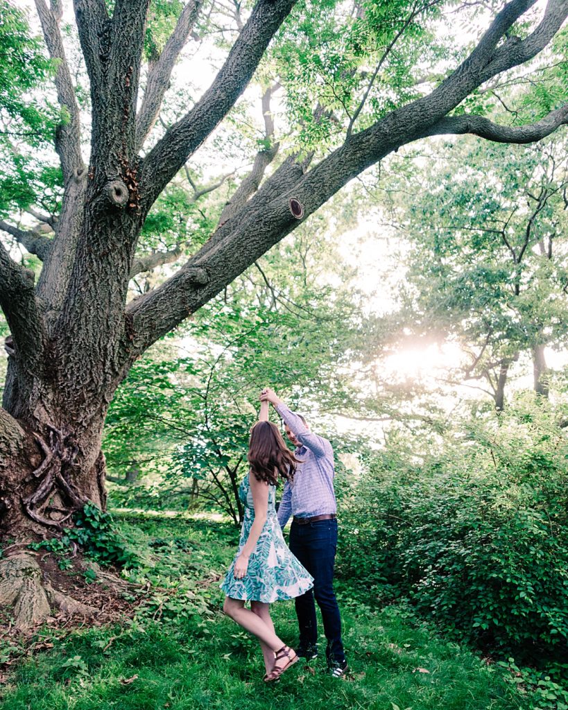 Dancing in the Park at Sunset under a beautiful tree | Engagement Photos Boston